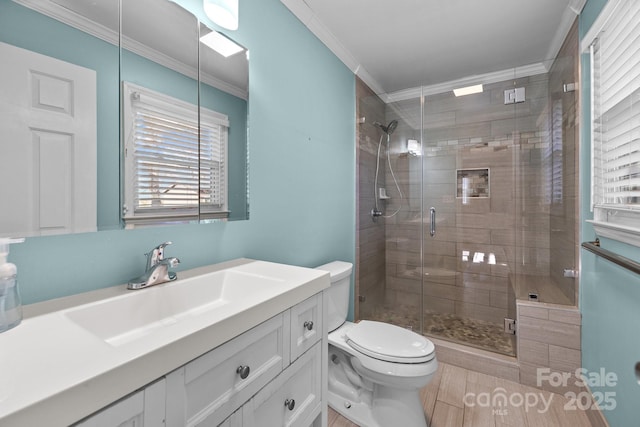 bathroom with vanity, crown molding, tile patterned flooring, toilet, and a shower with shower door