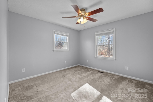 empty room with light carpet and ceiling fan