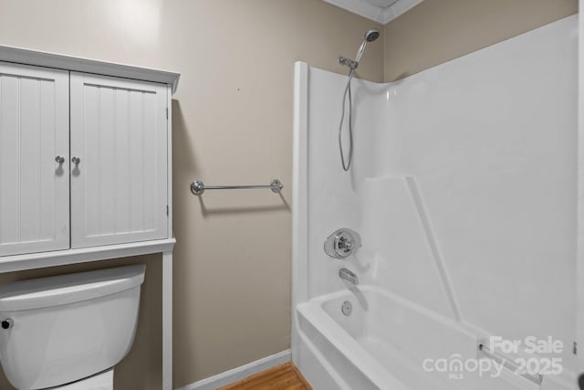 bathroom featuring toilet and washtub / shower combination