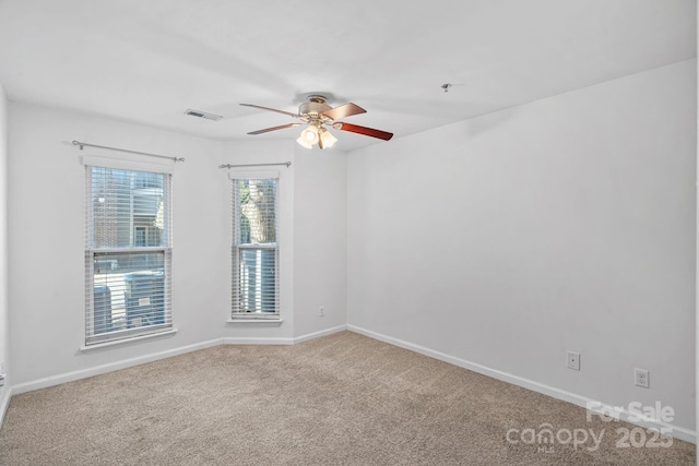 carpeted empty room with ceiling fan