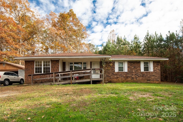 single story home featuring brick siding, crawl space, a porch, and a front lawn