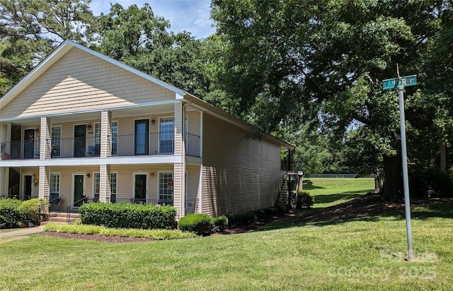 1985 Lancer Ct, Gastonia, NC 28054 - view of side of home with a porch, a yard, and a balcony
