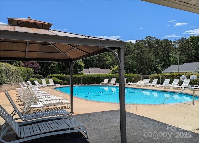 1985 Lancer Ct, Gastonia, NC 28054 - community pool featuring a gazebo, a patio area, and view of scattered trees