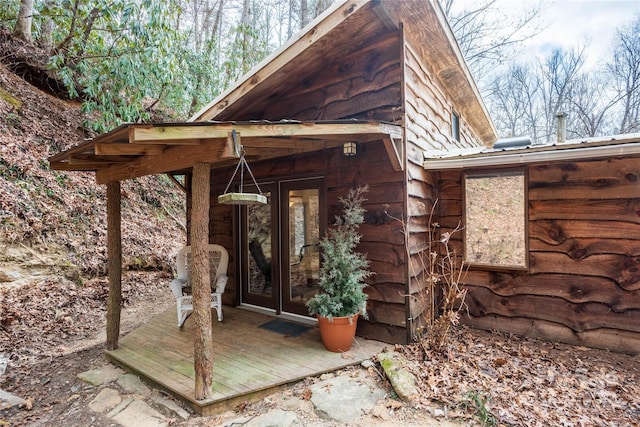 view of exterior entry featuring french doors