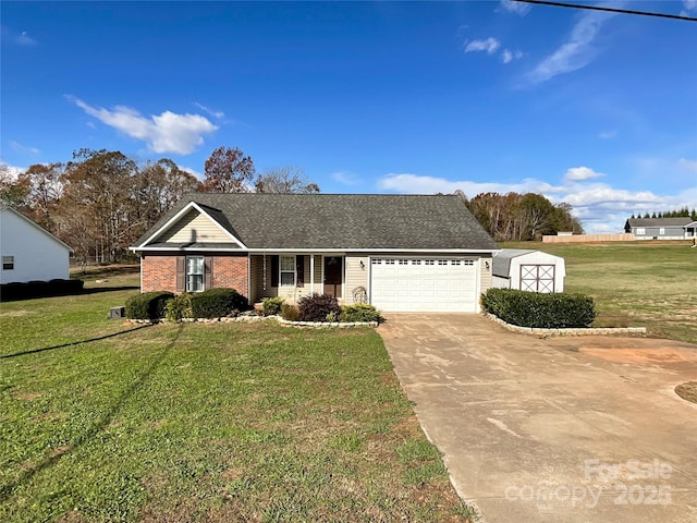 view of front of property featuring a garage and a front yard