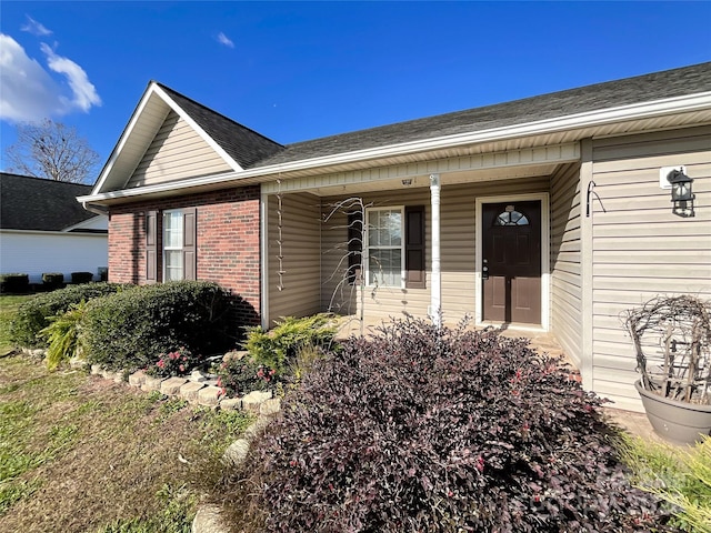 property entrance featuring a porch