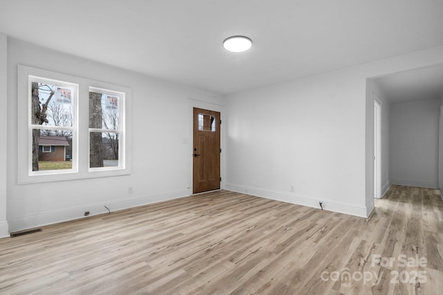 foyer with light wood-type flooring