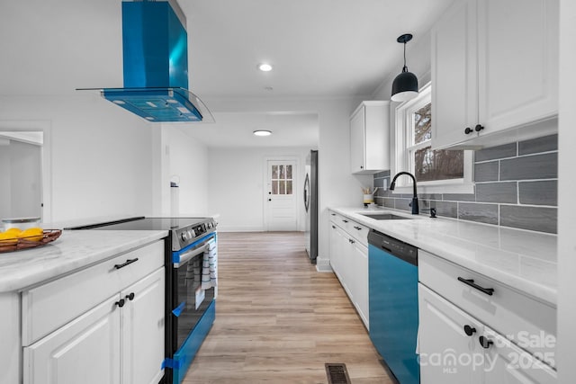 kitchen with sink, hanging light fixtures, ventilation hood, white cabinets, and appliances with stainless steel finishes