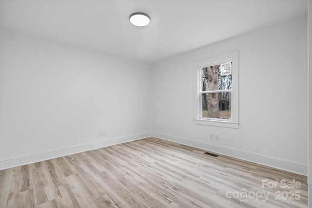 unfurnished room featuring light wood-type flooring