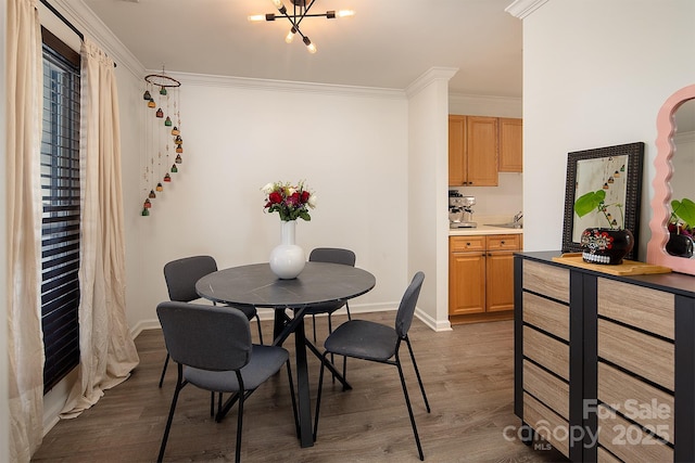 dining room featuring ornamental molding, an inviting chandelier, and dark hardwood / wood-style flooring