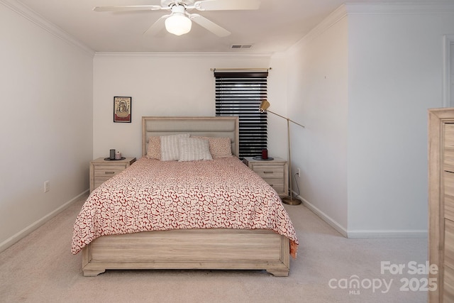 bedroom with crown molding, light colored carpet, and ceiling fan