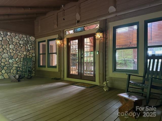 interior space featuring beamed ceiling and french doors