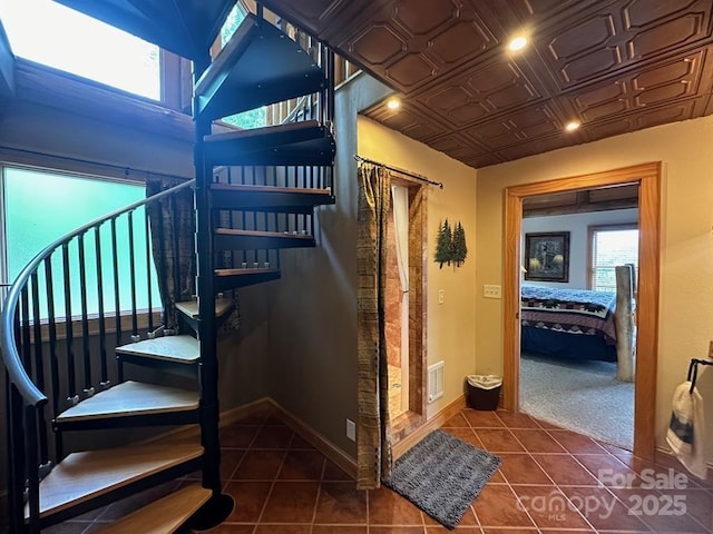 staircase with tile patterned floors