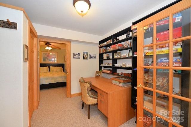 office with ceiling fan and light carpet