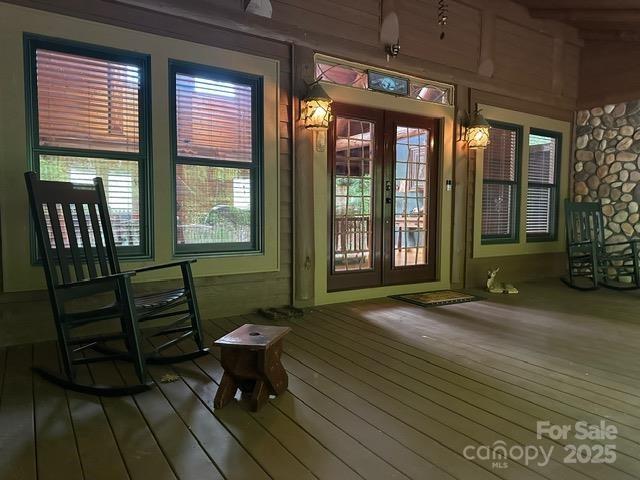 unfurnished sunroom featuring french doors