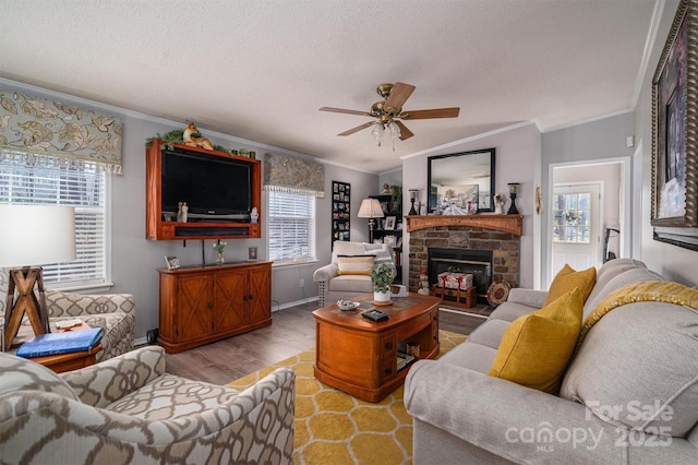 living room featuring lofted ceiling, light hardwood / wood-style floors, ceiling fan, and ornamental molding