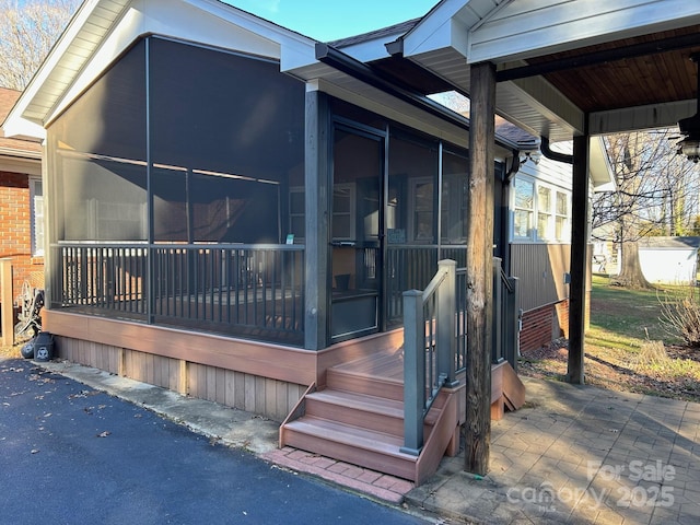 view of home's exterior featuring a sunroom