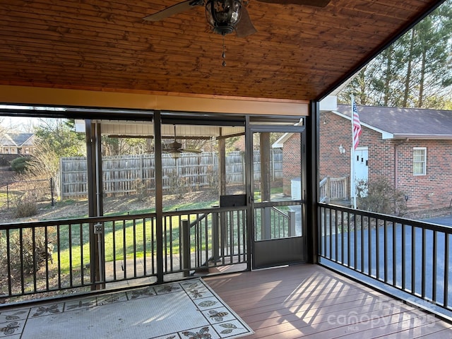 unfurnished sunroom with vaulted ceiling and wood ceiling