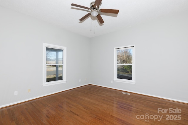 unfurnished room featuring hardwood / wood-style floors and ceiling fan