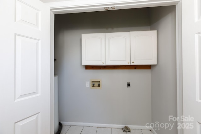 clothes washing area featuring electric dryer hookup, cabinets, light tile patterned floors, and hookup for a washing machine