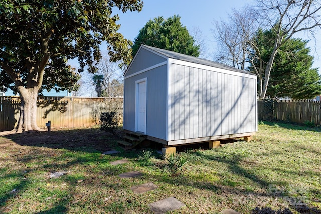 view of outdoor structure featuring a lawn