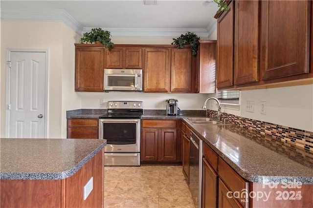 kitchen featuring appliances with stainless steel finishes, ornamental molding, and sink