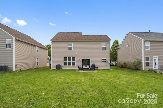 back of property featuring a yard, a patio, and central AC