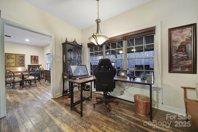 home office with dark hardwood / wood-style flooring