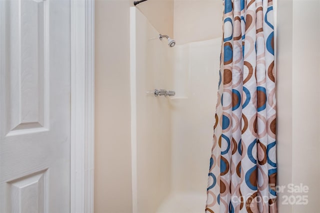 bathroom featuring walk in shower