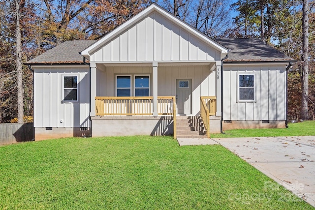 view of front of house with a porch and a front lawn