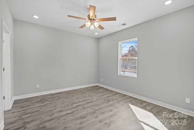 spare room featuring ceiling fan and wood-type flooring