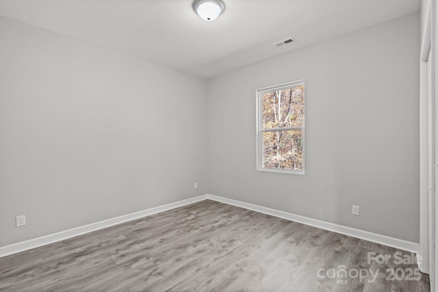 empty room featuring hardwood / wood-style floors