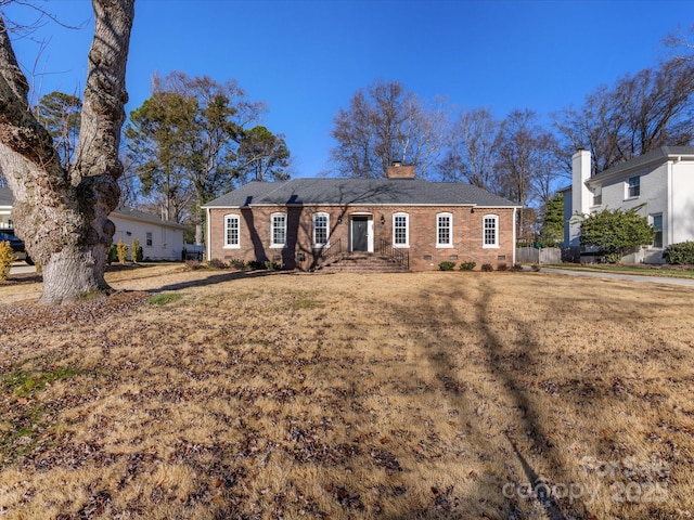 ranch-style home with a front yard