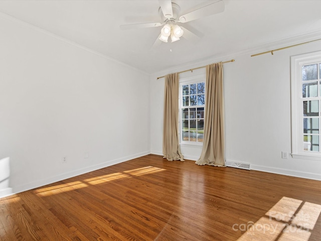 unfurnished room featuring hardwood / wood-style floors, plenty of natural light, ceiling fan, and crown molding