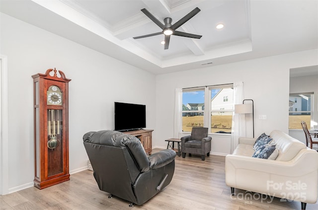 living room featuring ceiling fan, beam ceiling, light wood-type flooring, and coffered ceiling