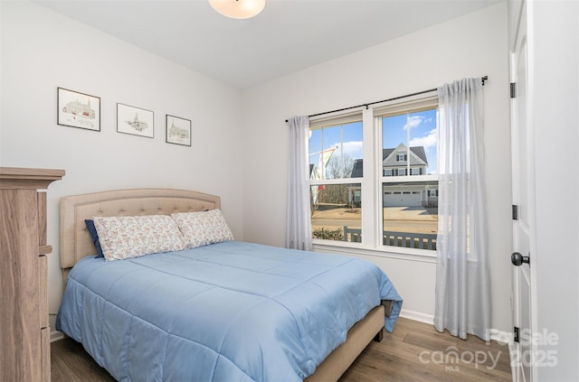 bedroom featuring dark hardwood / wood-style floors