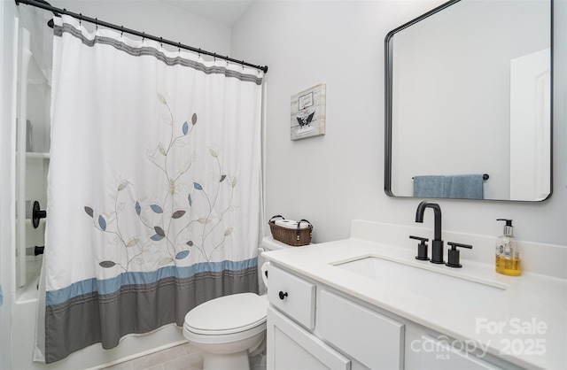 full bathroom featuring tile patterned floors, vanity, toilet, and shower / tub combo