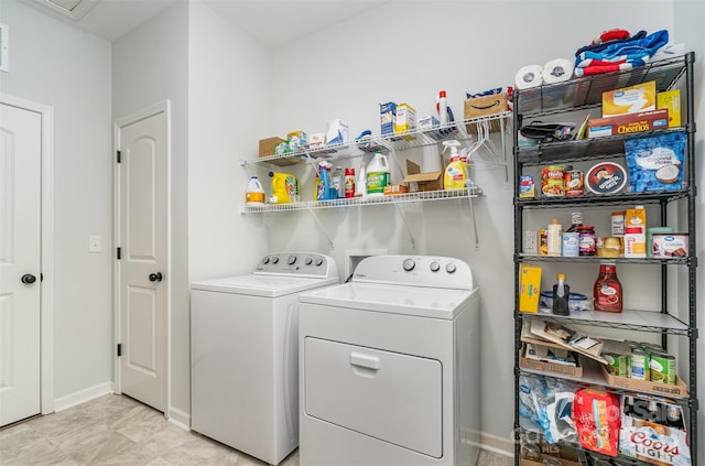 clothes washing area with independent washer and dryer