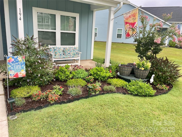194 Tillery Ln, Mount Gilead, NC 27306 - view of green lawn with a porch