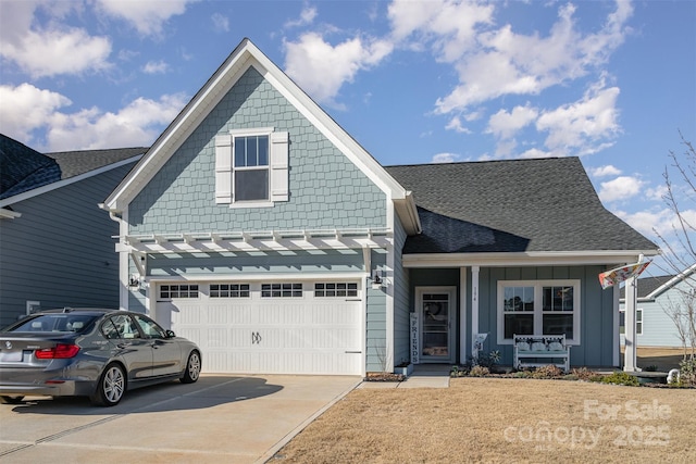 194 Tillery Ln, Mount Gilead, NC 27306 - view of front of property featuring covered porch, concrete driveway, roof with shingles, and board and batten siding