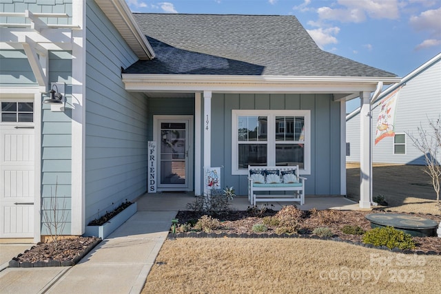 194 Tillery Ln, Mount Gilead, NC 27306 - property entrance featuring a porch, roof with shingles, and board and batten siding