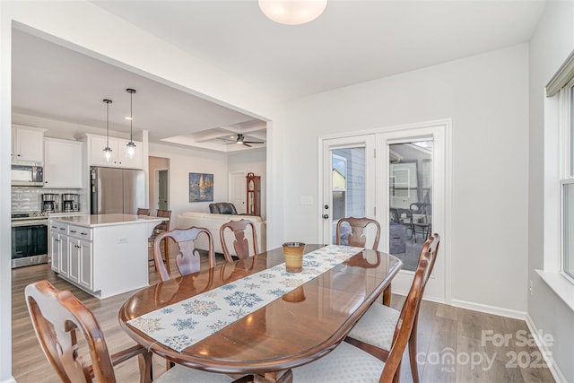 194 Tillery Ln, Mount Gilead, NC 27306 - dining room featuring wood finished floors, coffered ceiling, ceiling fan, and beam ceiling
