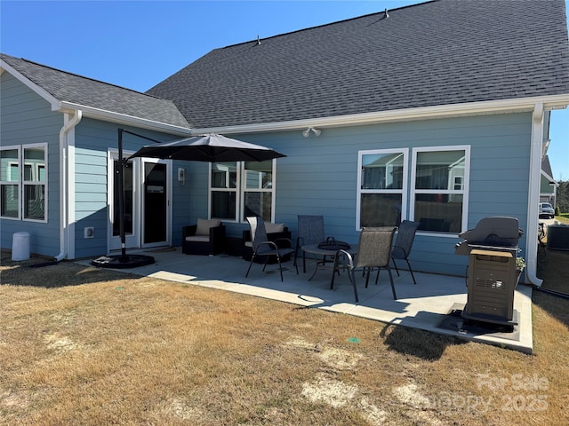 194 Tillery Ln, Mount Gilead, NC 27306 - rear view of house featuring a patio area, a shingled roof, and a yard