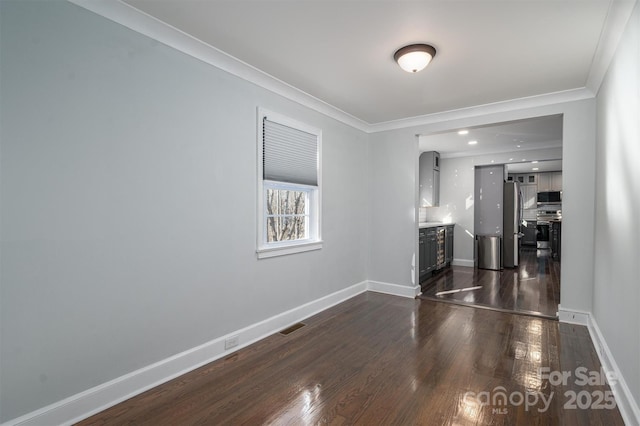 unfurnished room with crown molding and dark hardwood / wood-style floors