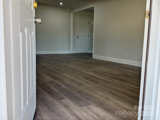 empty room featuring dark hardwood / wood-style floors