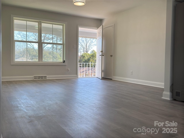 empty room featuring dark hardwood / wood-style flooring