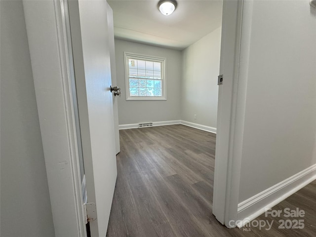 hall featuring dark wood-type flooring