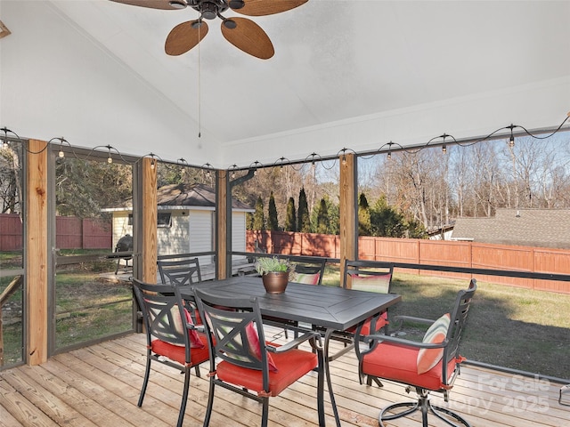 sunroom featuring ceiling fan and lofted ceiling