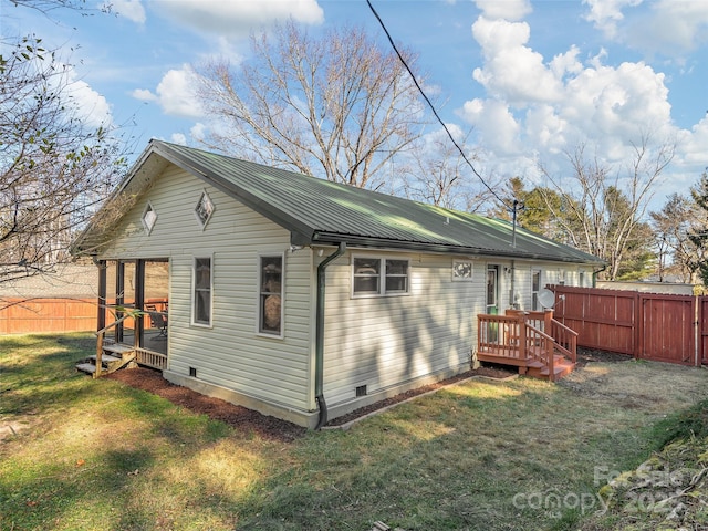 view of property exterior with a yard