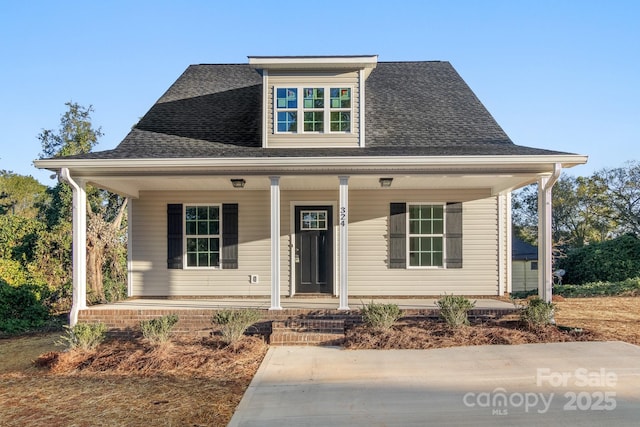 bungalow-style house featuring covered porch and roof with shingles